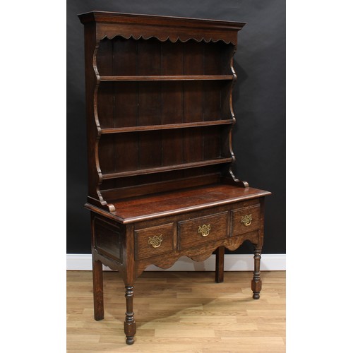 1510 - Frank Pratt of Derby - a George III style oak dresser, moulded cornice above a shaped apron and thre... 