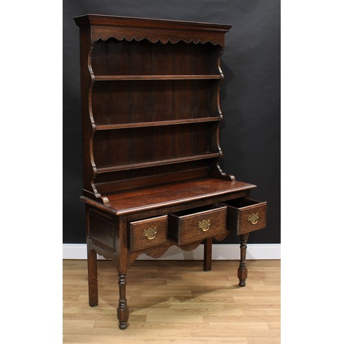 1510 - Frank Pratt of Derby - a George III style oak dresser, moulded cornice above a shaped apron and thre... 