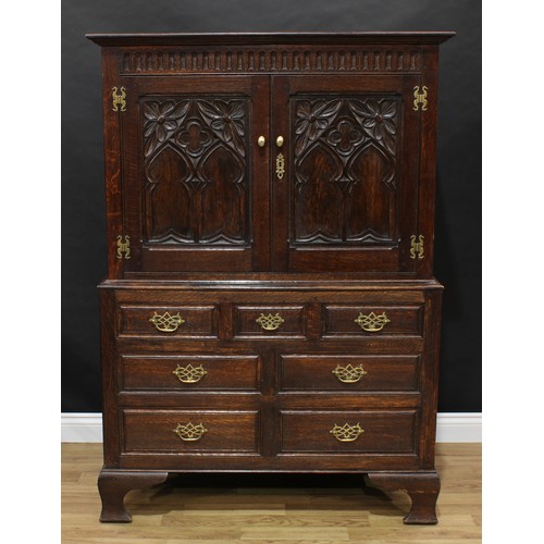 1505 - Frank Pratt of Derby - a 17th century style oak press cupboard, moulded cornice above a nulled friez... 