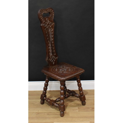 1517 - Frank Pratt of Derby - a Victorian style oak spinning chair, shaped back with pierced handle carved ... 