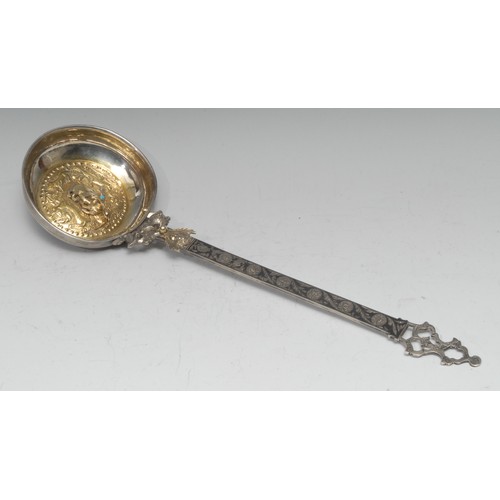 731 - An unusual 19th century Russian silver and niello ladle, the gilt circular bowl chased with birds an... 