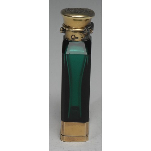 676 - A Victorian silver-gilt mounted emerald glass novelty combination scent bottle and vinaigrette, spru... 