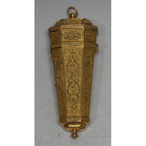 854 - An 18th century gilt-metal tapering octagonal etui, the panelled exterior chased in the Baroque tast... 