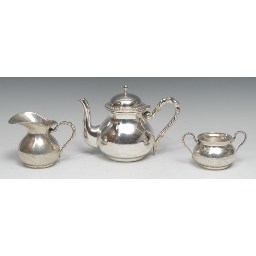 730 - An Italian silver three piece tea service, comprising teapot, milk jug and sugar basin, rope-twist b... 