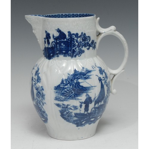 94 - A Caughley Pleasure Boat pattern mask jug, printed in underglaze blue with Chinoiserie landscape vig... 