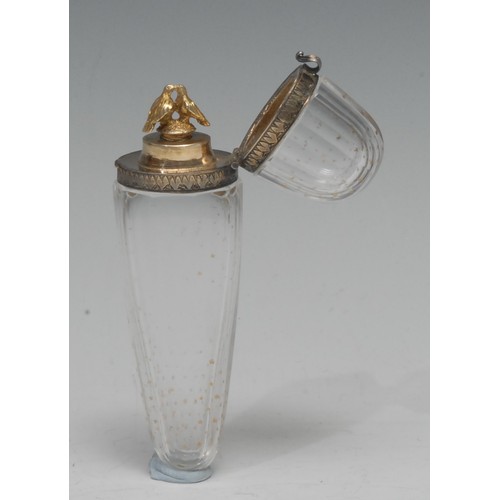 856 - An early 19th century French yellow metal-mounted glass tapering scent flask, the hinged cover enclo... 