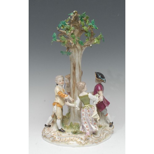 134 - A Meissen figural group, Ring-a-Ring-a-Roses, modelled with four figures in 18th century dress danci... 