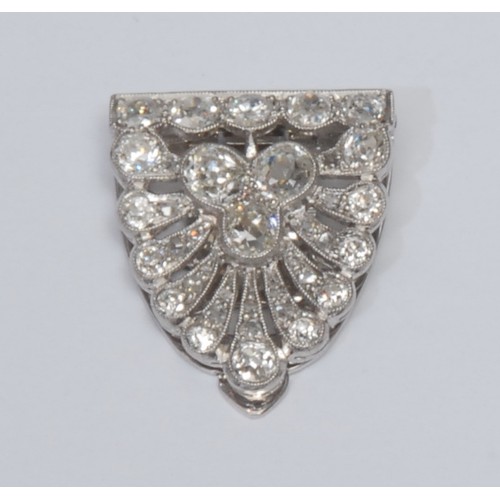 823 - An Art Deco diamond encrusted collar clip, peacock tail fan design encrusted with thirty five round,... 