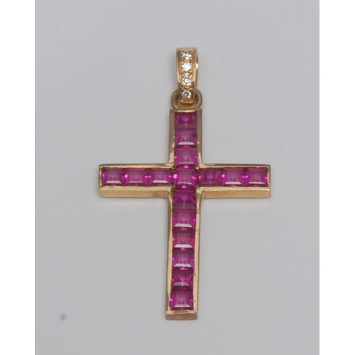 807 - A ruby and diamond cross pendant, channel set with sixteen square baguette cut pinky red rubies, (po... 