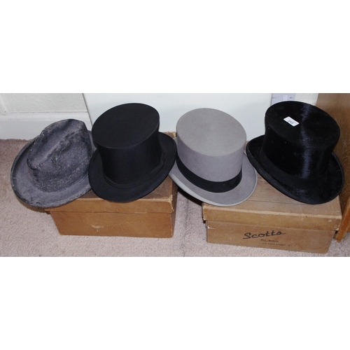 213 - A Lincoln Bennet and Co top hat, 55cm circumference;  another collapsible;  a Scotts and Co grey top... 