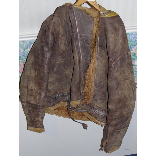 249 - A World War II RAF leather and sheepskin flying jacket, with yellow hood used by Coastal Command

**... 