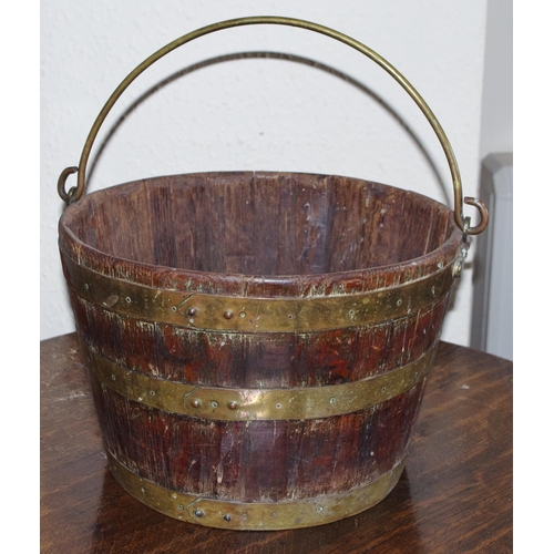 86 - A 19th century brass bound coopered oak bucket, swing handle, 25cm high, 35cm diam

**Please note al... 