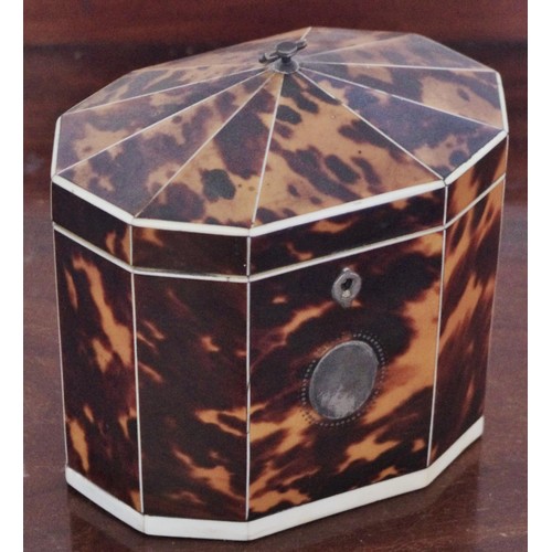 266 - A George III tortoiseshell hexagonal single compartment tea caddy, pointed domed cover, silver axe-h... 