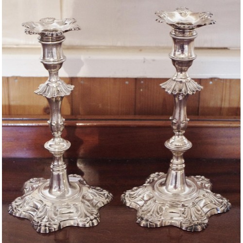 275 - A pair of  18th century silver candlesticks, everted sconces, knopped fluted columns, shaped bases, ... 