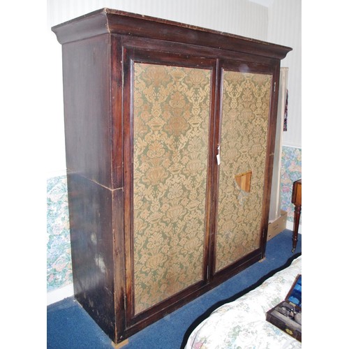 125 - A large Victorian faux rosewood scumbled pine country house linen cupboard, moulded outswept cornice... 