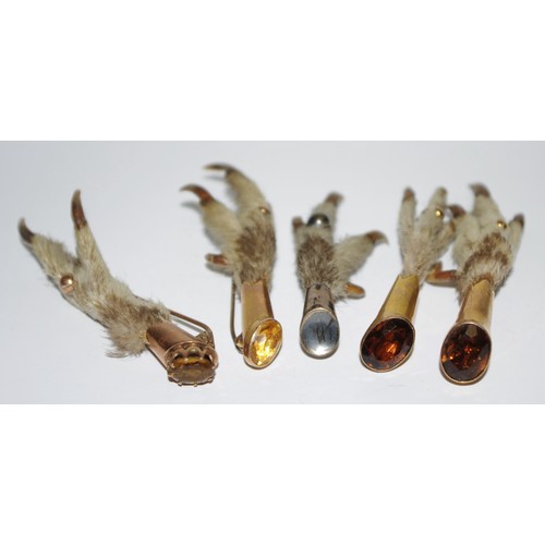 308 - Four Victorian Scottish  metal mounted  owls foot 'lucky' brooches, each set with an oval facetted c... 