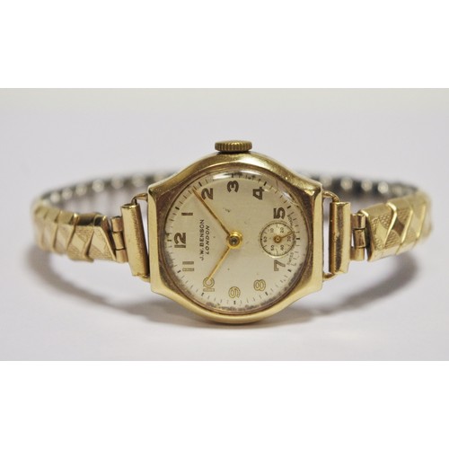 320 - A lady's 9ct gold wristwatch, silvered dial with subsiduary seconds dial, J W Benson, London, gold p... 