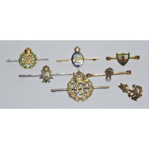 323 - A diamond and seed pearl sweetheart brooch, for the Grenadier Guards;  a 9ct gold military sweethear... 