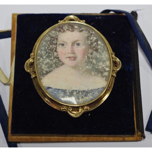 345 - English School, a 19th century  portrait brooch, set with a large oval miniature of a girl, watercol... 