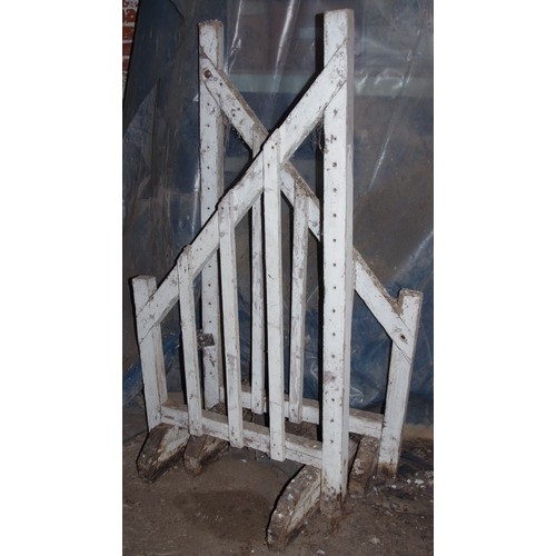 295 - A wooden saddle horse and two wall mounted saddle racks;  two show jump wings;  bits, stirrups;   et... 