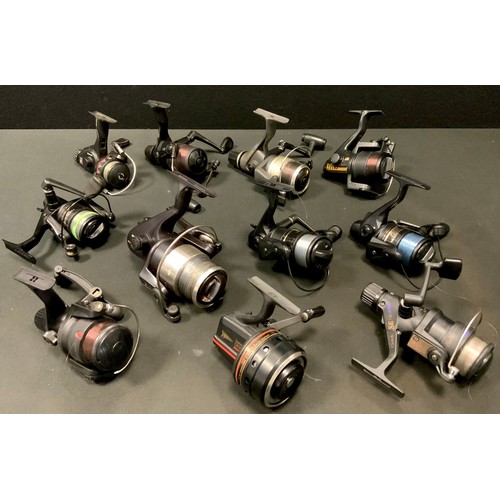 Twelve fishing reels including a Team Daiwa Match-S 2503A; another