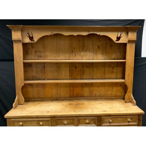 104 - A 20th century French style pine kitchen dresser, swallow cut two shelf back above deep base fitted ... 