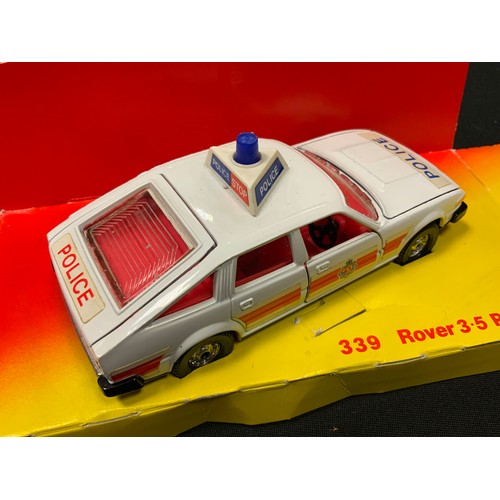 82 - A Corgi 1118 Chubb Pathfinder, red, yellow interior, gold nozzle; a Corgi 339 Rover 3.5 Police car; ... 