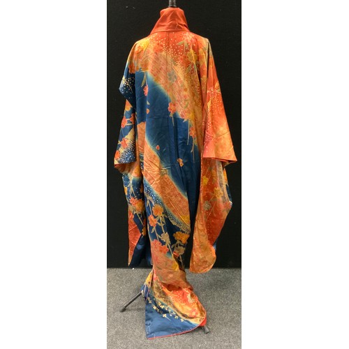 144 - Fashion & Textiles - A Japanese Kimono decorated with butterflies and flowers upon a russet and blue... 