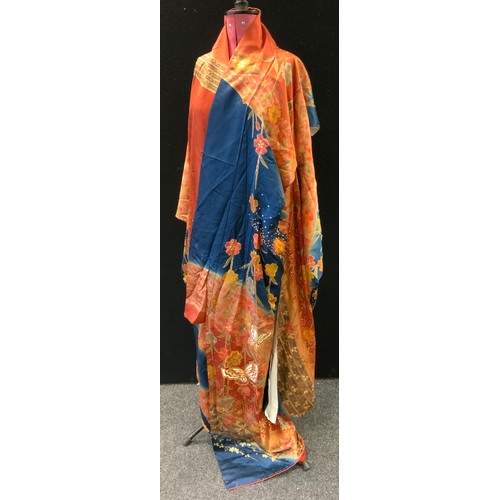 144 - Fashion & Textiles - A Japanese Kimono decorated with butterflies and flowers upon a russet and blue... 