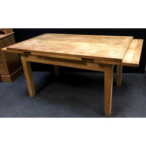 184 - A contemporary light oak extending dining table. 81cm high x 91.5cm wide x 153cm long extending to 2... 