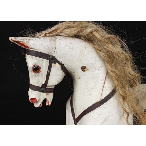 5180 - A late 19th/early 20th century children's rocking horse of small proportions, the carved, gesso and ... 