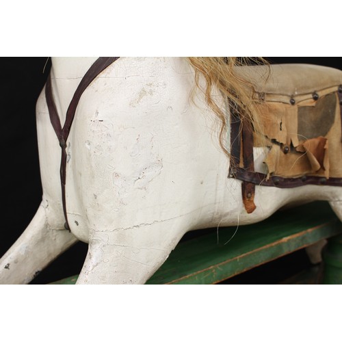 5180 - A late 19th/early 20th century children's rocking horse of small proportions, the carved, gesso and ... 