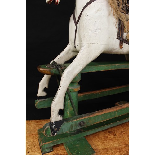 5180 - A late 19th/early 20th century children's rocking horse of small proportions, the carved, gesso and ... 