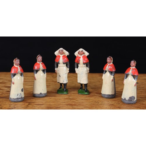 5237 - W Britain (Britains) four hollow cast lead first version Nurse figures, wearing red capes and white ... 