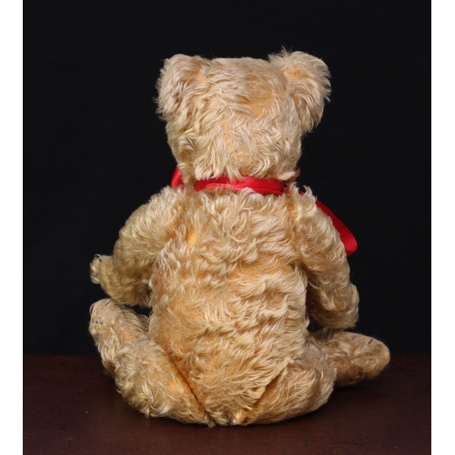 5185A - A 1930's Chiltern golden mohair jointed teddy bear, glass eyes with remains of brown painted backs, ... 