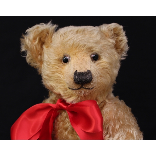 5185A - A 1930's Chiltern golden mohair jointed teddy bear, glass eyes with remains of brown painted backs, ... 