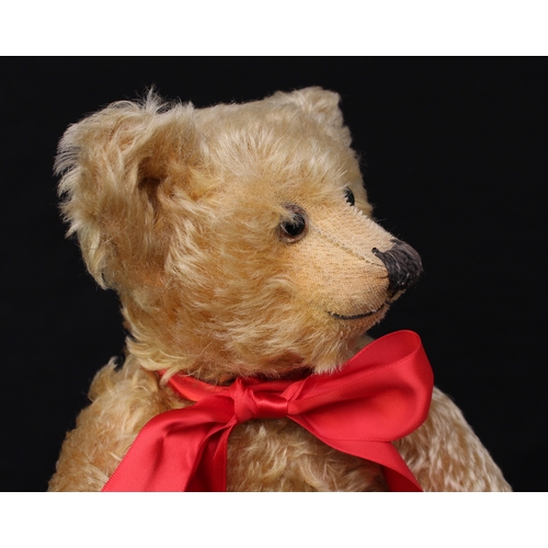5185A - A 1930's Chiltern golden mohair jointed teddy bear, glass eyes with remains of brown painted backs, ... 