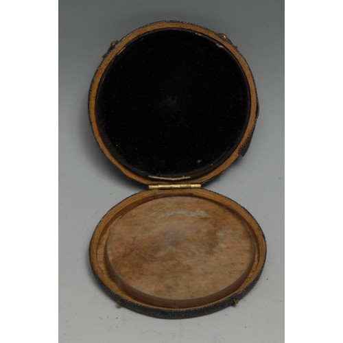 3452 - An 18th century shagreen circular pocket case, hinged cover enclosing a magnifying lens, 7cm diam, c... 