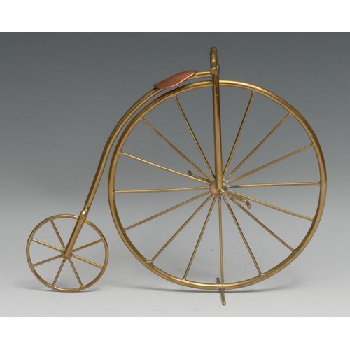 3589 - Cycling - a brass and copper desk model, of a penny farthing or ordinary bicycle, 22cm high