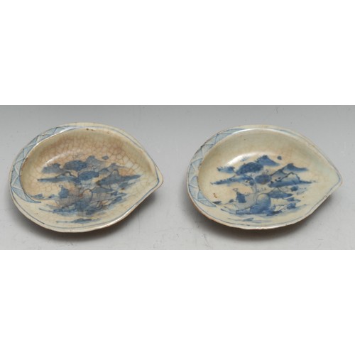 3214 - A pair of Japanese porcelain brush washers, each as an abalone shell, painted in tones of underglaze... 