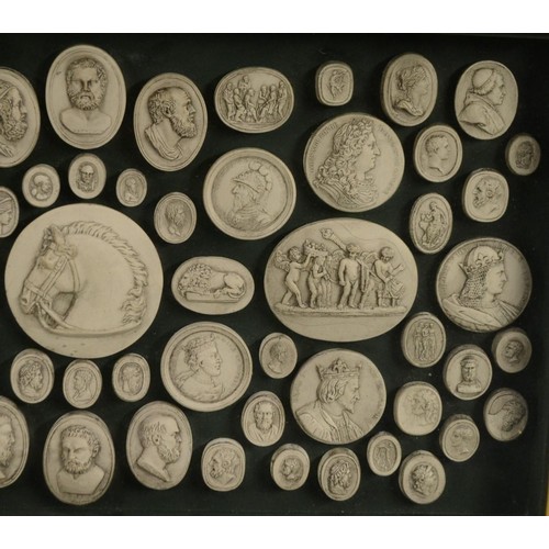 3460 - An arrangement of Grand Tour style plaster intaglio impressions, various Classical and Medieval subj... 