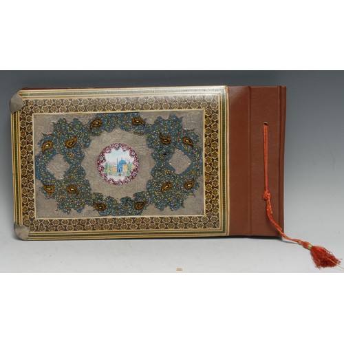 3346 - A Persian papier-mâché and marquetry rounded rectangular photograph album, the front painted with a ... 