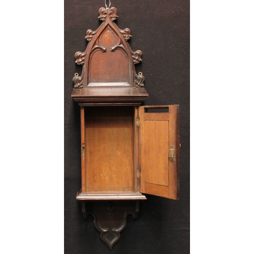 3049 - A 19th century Gothic Revival oak wall mounted country house post box, shaped cresting, moulded corn... 