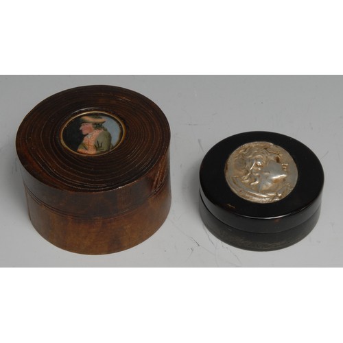 3208 - A hardwood circular snuff box, the push-fitting cover mounted with a portrait of a gentleman in 18th... 