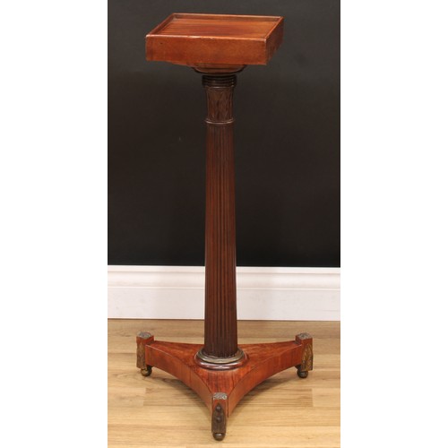 3368 - A Regency rosewood columnar pedestal, the fluted pillar with lotus capital, incurved tri-form base, ... 