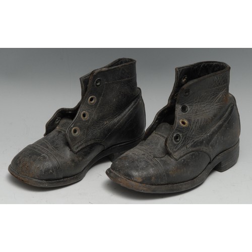 3587 - Costume - a pair of early 20th century child's black leather boots, hobnailed soles, 17.5cm long