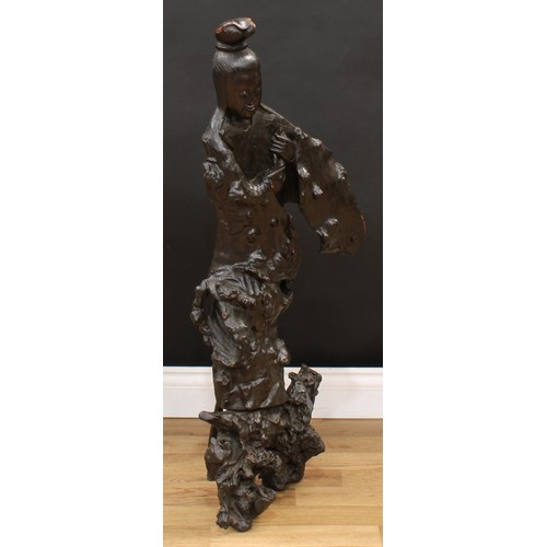 3229 - A large Chinese rootwood carving, of Guanyin, 101cm high, early 20th century