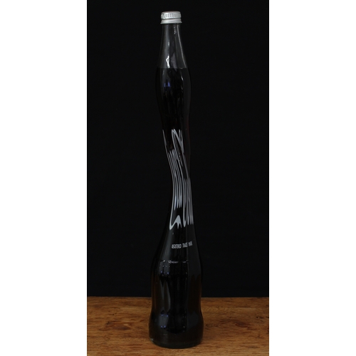 5466B - Advertising - an unusual stretched and twisted novelty glass Coca-Cola bottle, silver screw top lid,... 