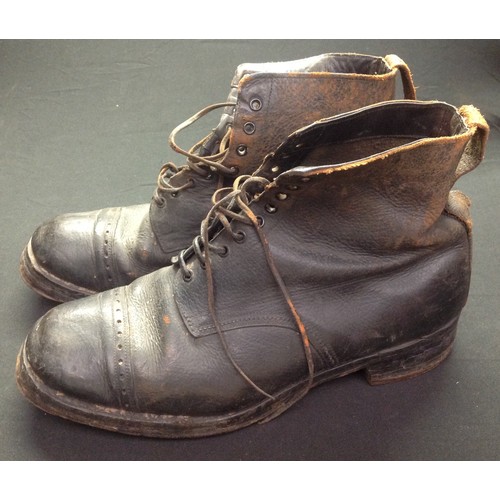 65 - A pair of black leather lace up ankle boots. Marked to the inside on both boots 