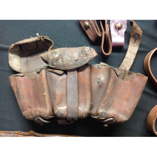 144 - WW2 British / US / German leatherwork collection to comprise of: two leather shoulder holsters, both... 